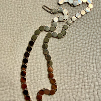 vintage 14k gold Necklace with hexagonal link on a textured beige surface penelopepenelope.com