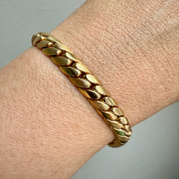 14k Gold chain bracelet on a wrist with a neutral background. Penelope Penelope Vintage 18k gold fine jewelry