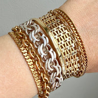 18k gold and silver vintage bracelet stack on a wrist penelopepenelope.com