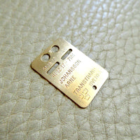 1979 Swedish Vintage Gold ID Card Pendant 18k Gold on beige background
