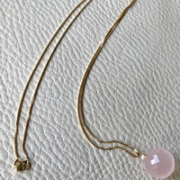 Sparkling! Rose quartz faceted orb pendant necklace set in 18k gold with 0.05 ct brilliant cut diamond by Ole Lynggaard