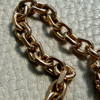 18k gold vintage biker link chain bracelet on gray textured surface penelopepenelope.com