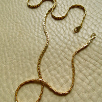 Vintage French Virola Link Chain Necklace 18k Gold – 15.75 Inch length on beige background