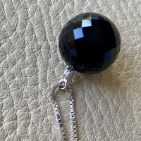 Brilliant! Black onyx faceted orb pendant necklace set in 18k white gold with 0.05 ct brilliant cut diamond by Ole Lynggaard