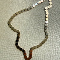 vintage 14k gold Necklace with hexagonal link on a textured beige surface penelopepenelope.com