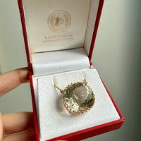 Necklace with a large smoky quartz gemstone in a red jewelry box