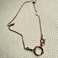 18k Gold antique bolt ring jewelry clasp attached to a watch chain