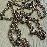 Silver chain on a textured surface