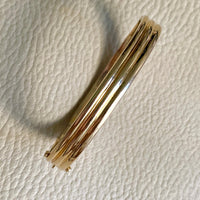 Made in 1952 - 18k gold hinged bangle with ridged hemispheres