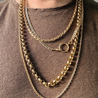 antique 18k Gold chain necklaces on a person wearing a brown shirt PenelopePenelope.com