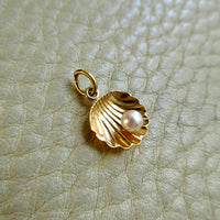 14k Gold Half Shell with Pearl pendant or charm - 0.6 inch on beige background
