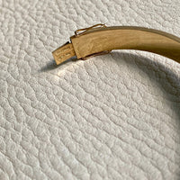 Made in 1952 - 18k gold hinged bangle with ridged hemispheres