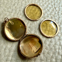 gold locket interior with photo covers removed