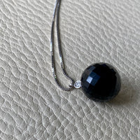 Brilliant! Black onyx faceted orb pendant necklace set in 18k white gold with 0.05 ct brilliant cut diamond by Ole Lynggaard