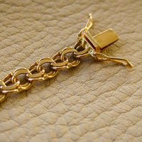Double link solid 18k gold bracelet 1972 Swedish vintage, 18K gold, 7 inch in inside circumference, a chunky 17.8 grams, perfect working clasp, fully hallmarked, sun catching radiant double link, GORGEOUS!!!! She is a classic you'll wear every day. 18k Yellow gold with a subtle warm rosy tint - stunning. This link type is called a double-link. Pairs of links run side by side - like two curb chains delicately soldered, link by link, to form a double length of links.