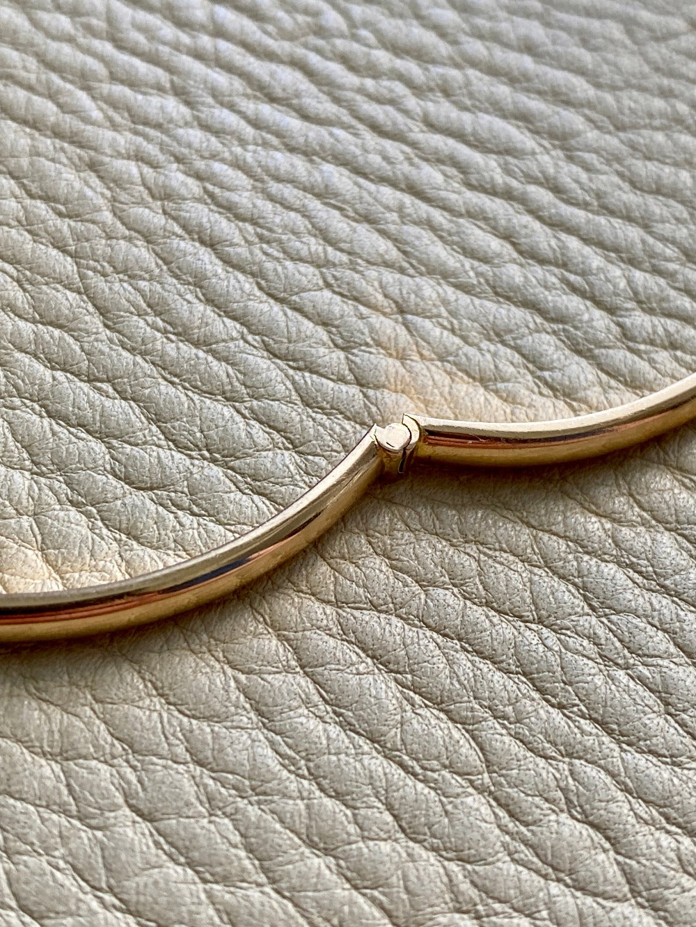 A solid gold hinged bangle made in 1978 in Sävsjö, Sweden. Solid bangles like this are rare finds! What I love about them is that they cannot dent - this style is a solid bar of gold!  This amazing vintage Scandinavian 18k gold bangle is oval shaped with a femme half-round cross section. Interior of the oval measures 2 inches (50mm) x 2.4 inches (60mm) and opens with a well working and beautiful hinge. She weighs an excellent 18.2g