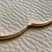 A solid gold hinged bangle made in 1978 in Sävsjö, Sweden. Solid bangles like this are rare finds! What I love about them is that they cannot dent - this style is a solid bar of gold! This amazing vintage Scandinavian 18k gold bangle is oval shaped with a femme half-round cross section. Interior of the oval measures 2 inches (50mm) x 2.4 inches (60mm) and opens with a well working and beautiful hinge. She weighs an excellent 18.2g