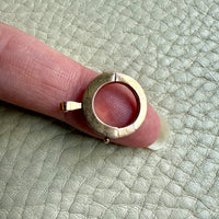 18k gold french antique bolt clasp on a fingertip
