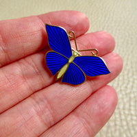 1952 Gilt Silver Enamel Butterfly Brooch by Tillander - 1.3 inch diameter held in hand over beige background