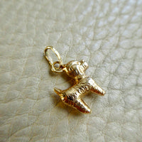 18k gold curly haired dog - poodle, doodle - pendant or charm - 0.9 inch on beige background