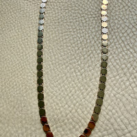 vintage 14k gold Necklace with hexagonal link on a textured beige surface penelopepenelope.com