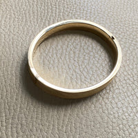 A beauty! 14k gold textured hinged bangle bracelet