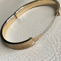 A beauty! 14k gold textured hinged bangle bracelet