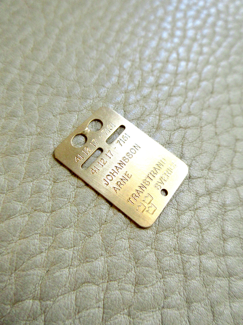 1979 Swedish Vintage Gold ID Card Pendant 18k Gold on beige background