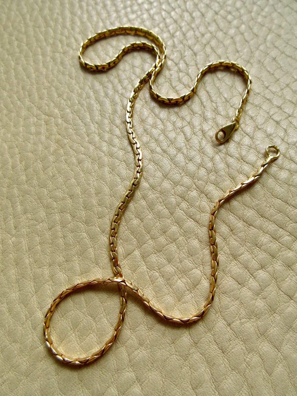 Vintage French Virola Link Chain Necklace 18k Gold – 15.75 Inch length on beige background