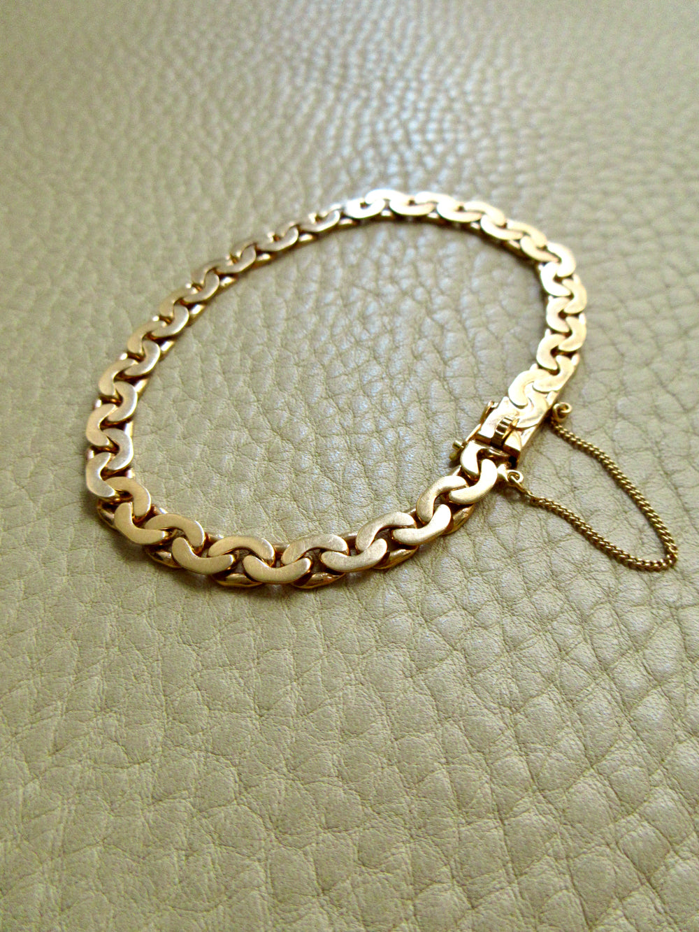 1940 Swedish Vintage Virola Link Bracelet 18k Gold – 7.5 Inch Length on beige background
