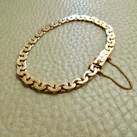 1940 Swedish Vintage Virola Link Bracelet 18k Gold – 7.5 Inch Length on beige background