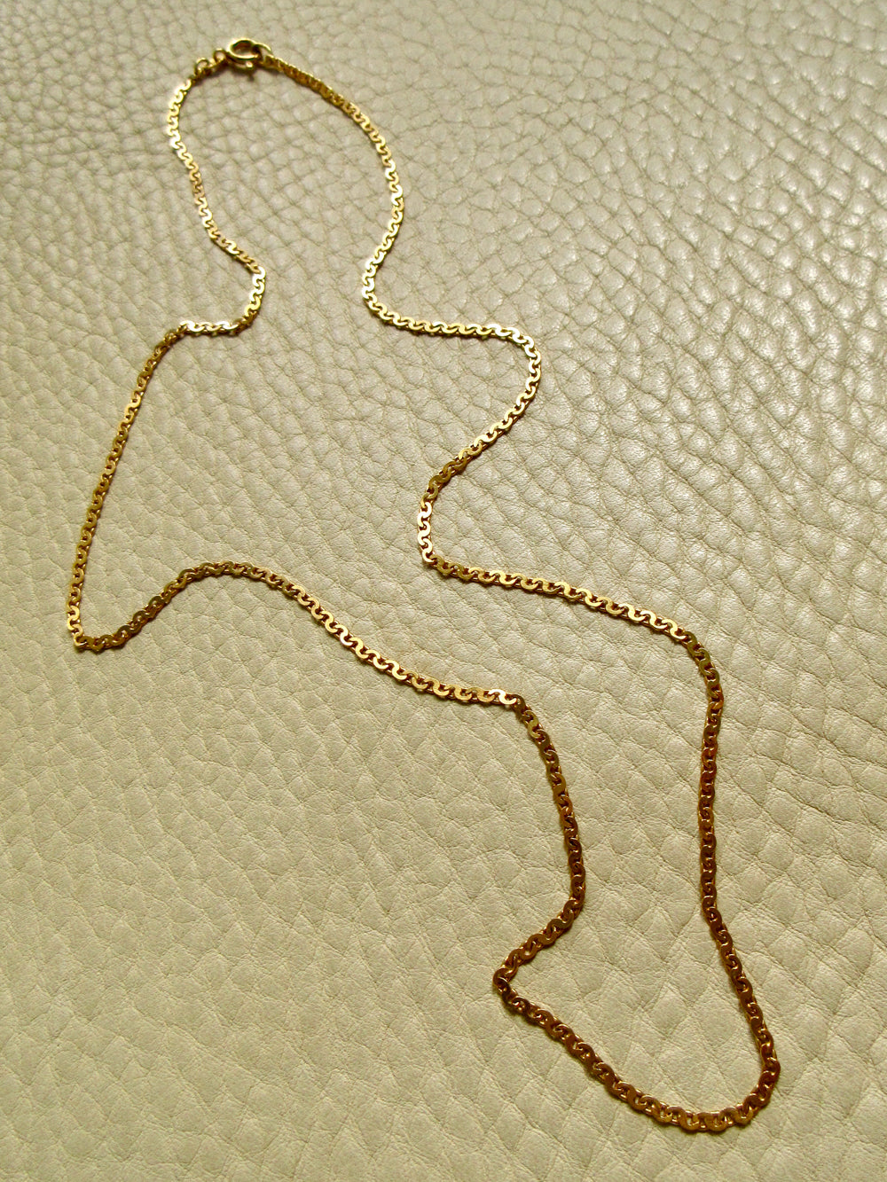 Skinny Vintage Swedish Virola Link Necklace 18k Gold – 19.7 Inch Length on beige background