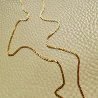 Skinny Vintage Swedish Virola Link Necklace 18k Gold – 19.7 Inch Length on beige background
