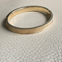 A beauty! 14k gold textured hinged bangle bracelet