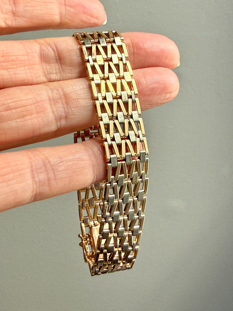 vintage 18k Gold link bracelet with a woven pattern in hand PenelopePenelope.com