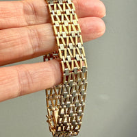 vintage 18k Gold link bracelet with a woven pattern in hand PenelopePenelope.com