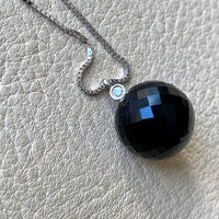 Brilliant! Black onyx faceted orb pendant necklace set in 18k white gold with 0.05 ct brilliant cut diamond by Ole Lynggaard