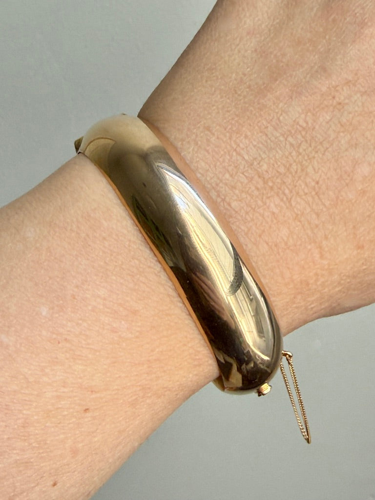 vintage 14k gold hinged bangle on wrist