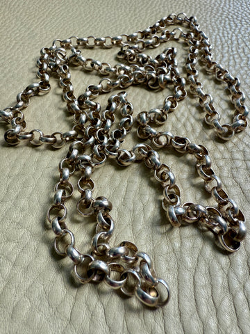 Silver chain on a textured surface
