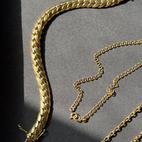 vintage gold link fine jewelry on tray