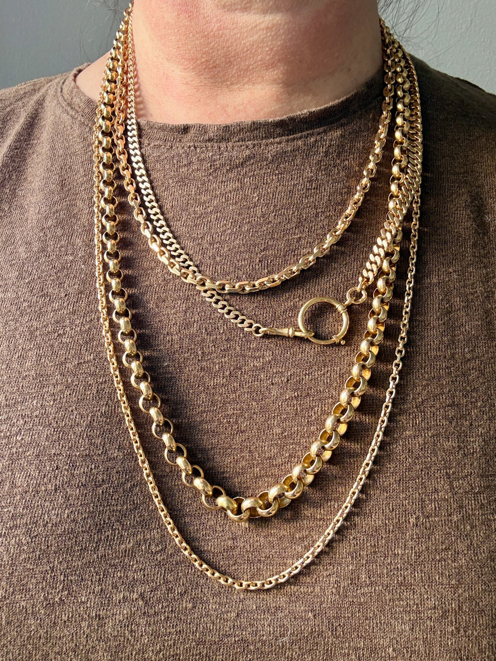 antique 18k Gold chain necklaces on a person wearing a brown shirt PenelopePenelope.com