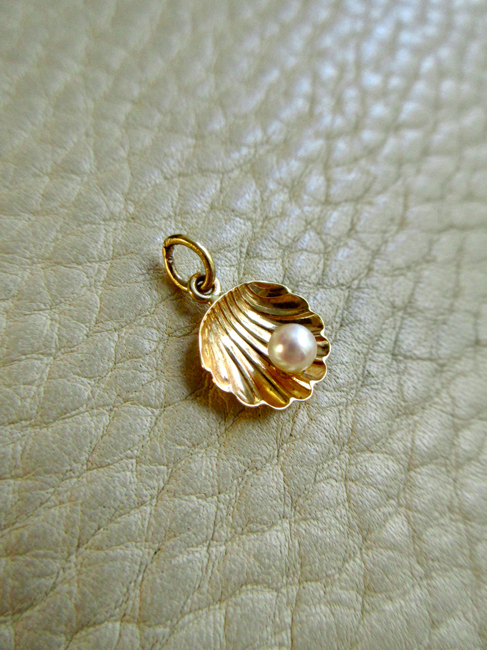 14k Gold Half Shell with Pearl pendant or charm - 0.6 inch on beige background