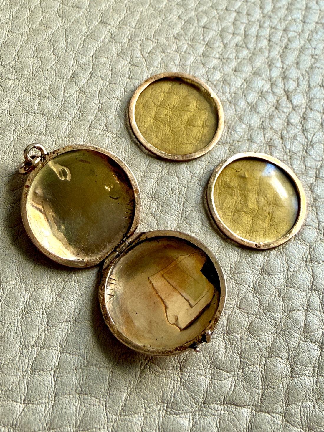 gold locket interior with photo covers removed