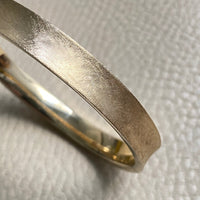 A beauty! 14k gold textured hinged bangle bracelet