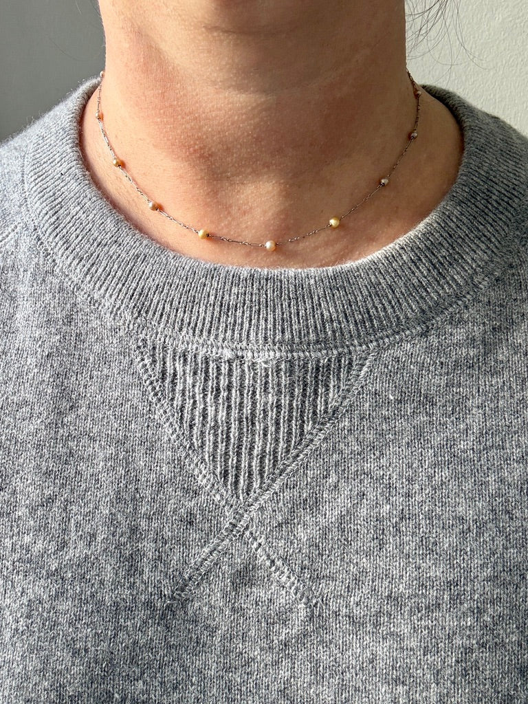platinum and pearl french antique necklace on person