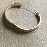 A beauty! 14k gold textured hinged bangle bracelet