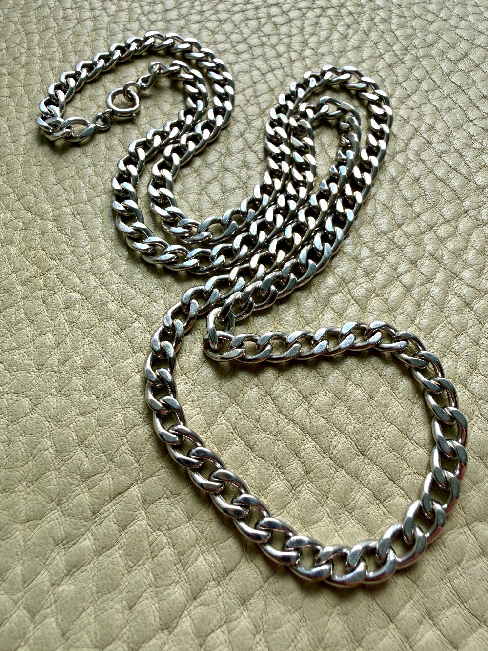 vintage 14k white gold chain necklace on a textured beige surface