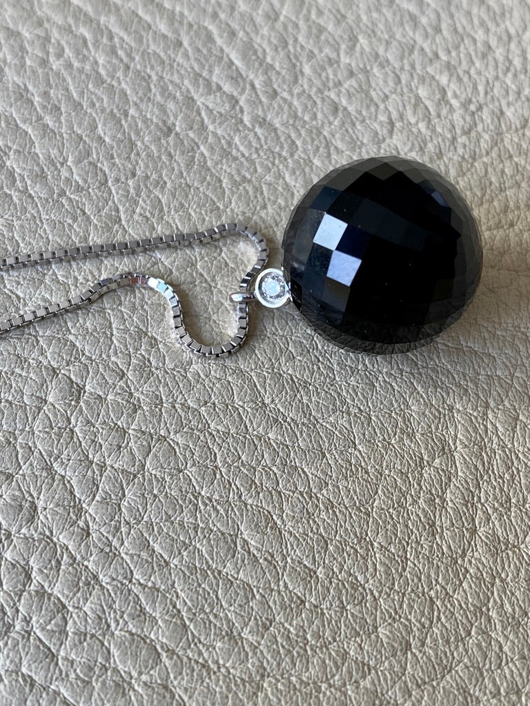 Brilliant! Black onyx faceted orb pendant necklace set in 18k white gold with 0.05 ct brilliant cut diamond by Ole Lynggaard