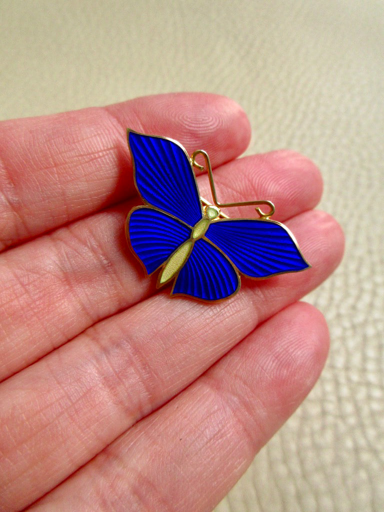 1952 Gilt Silver Enamel Butterfly Brooch by Tillander - 1.3 inch diameter held in hand over beige background
