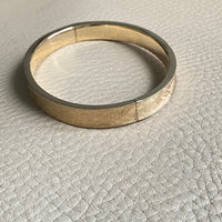 A beauty! 14k gold textured hinged bangle bracelet